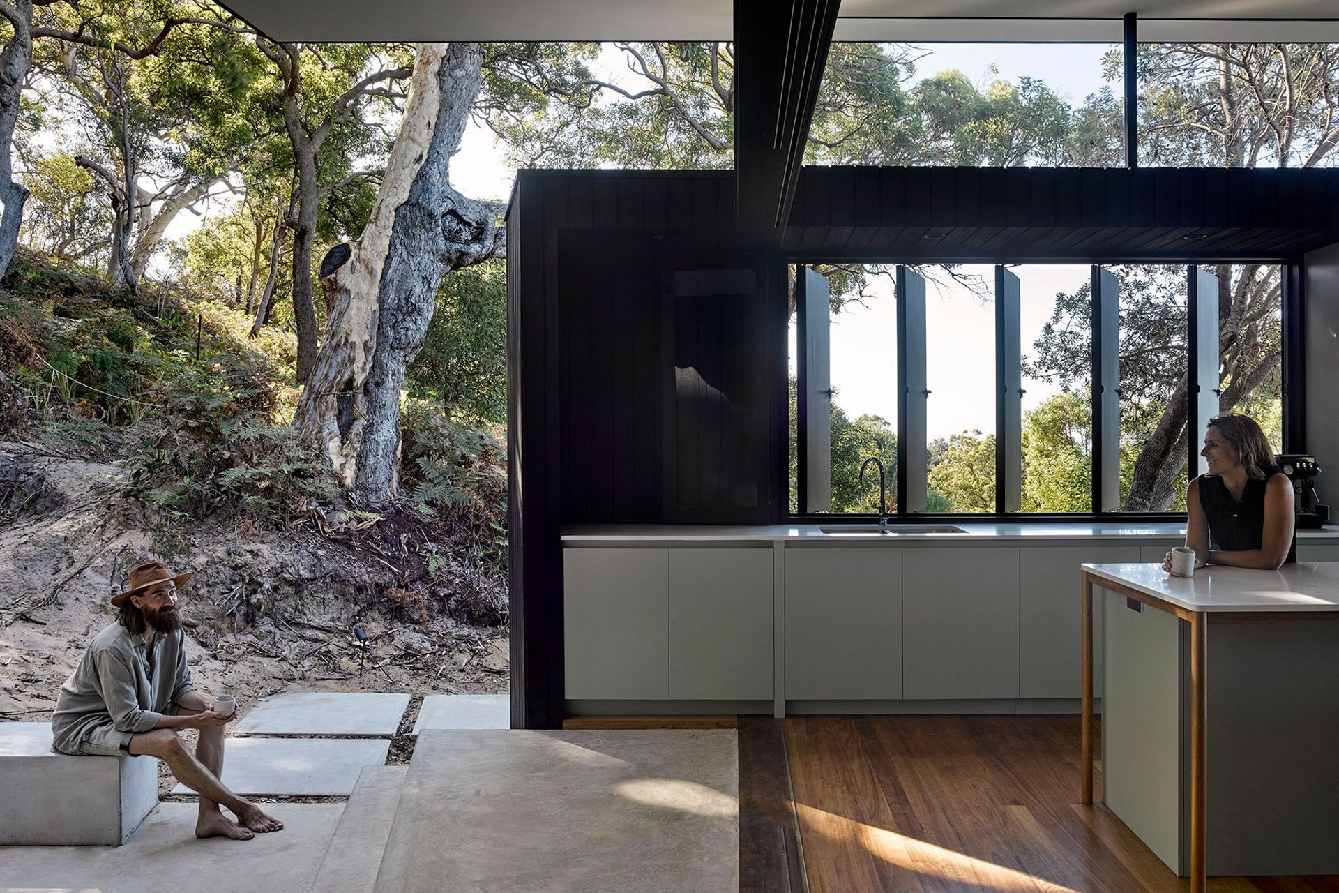 The outdoor bath is tucked away yet has the perfect outlook to the bush while the integrated fire place allows for gatherings secluded from the wind with distant ocean views