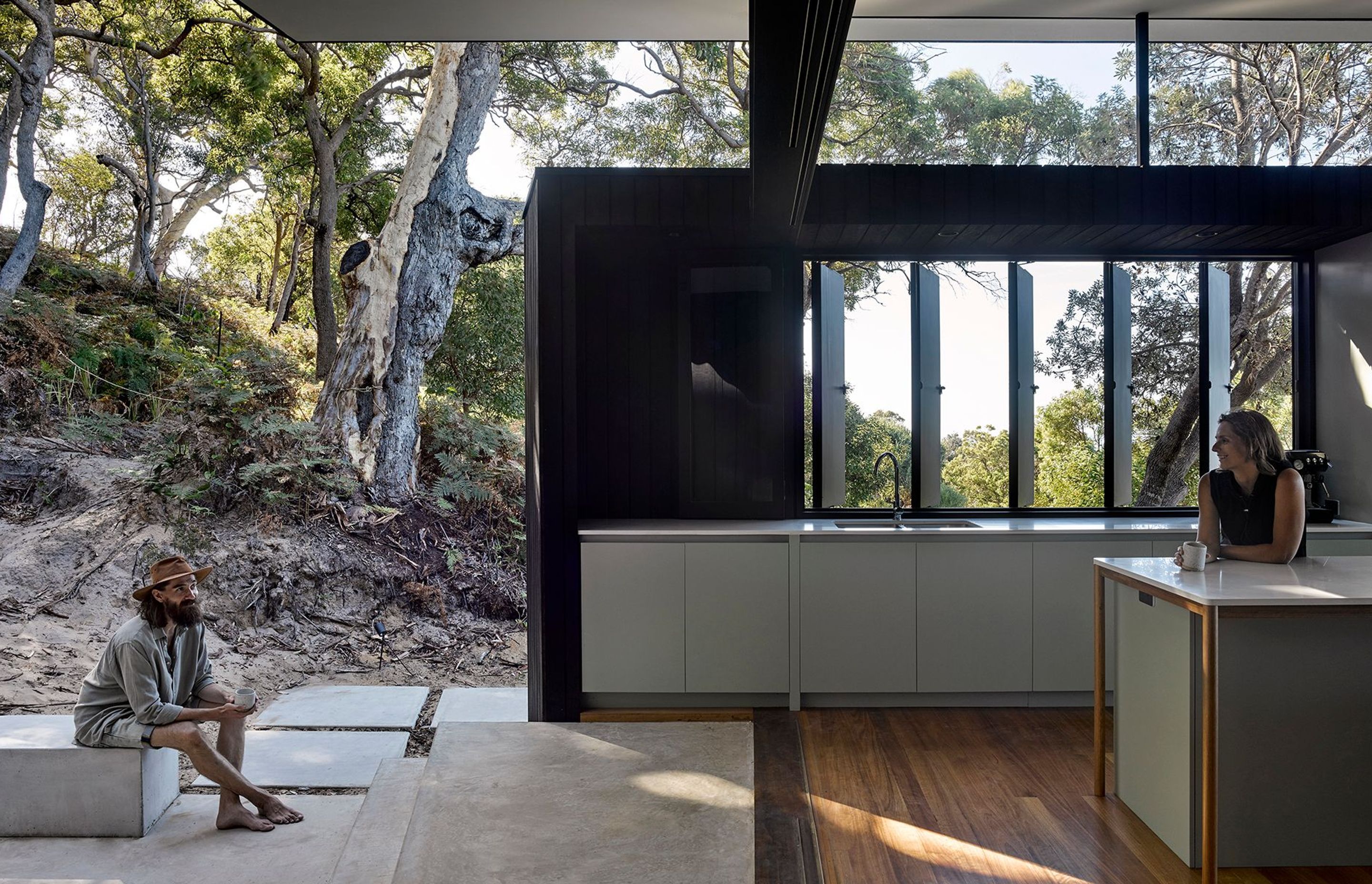 The outdoor bath is tucked away yet has the perfect outlook to the bush while the integrated fire place allows for gatherings secluded from the wind with distant ocean views