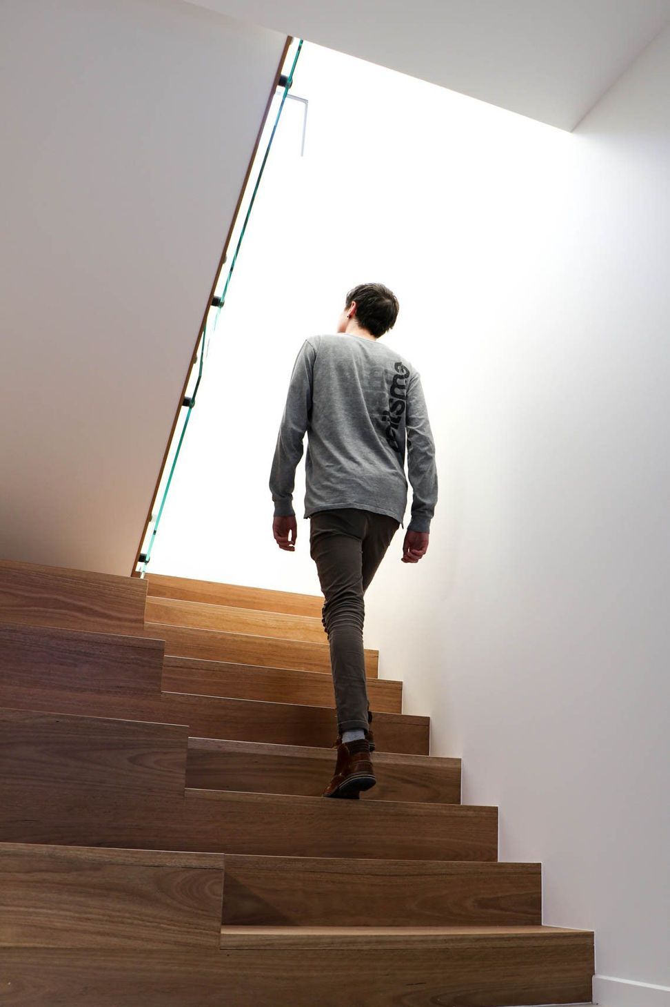 Anderson Residence - Staircase. Timber stair rising toward the light.