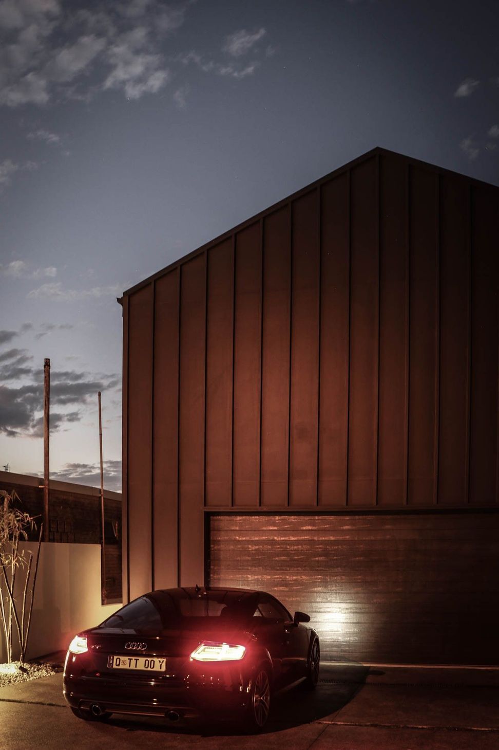 Anderson Residence - Exterior. Red cladding against a clear sky.