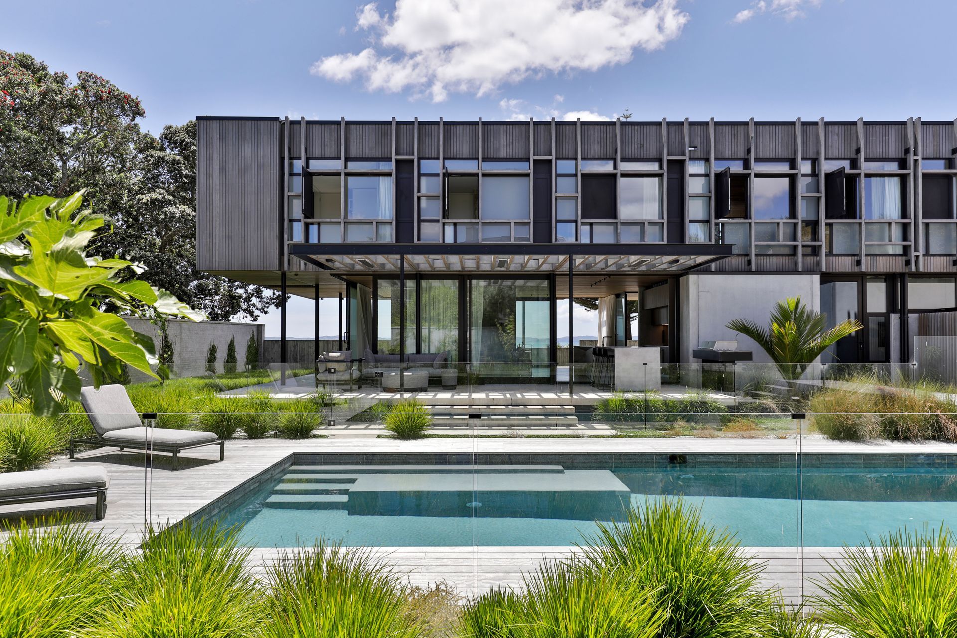 At the rear of the house, an outdoor living area and pool are a drawcard for the extended family.