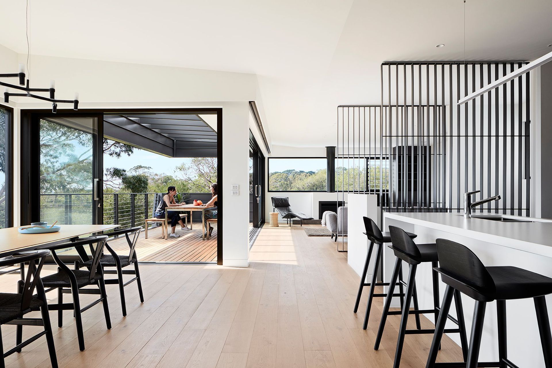 The northern outlook to sea and trees is enjoyed from the Kitchen across the dining area, and most importantly from a large entertaining deck – connecting completely with the client’s original brief.