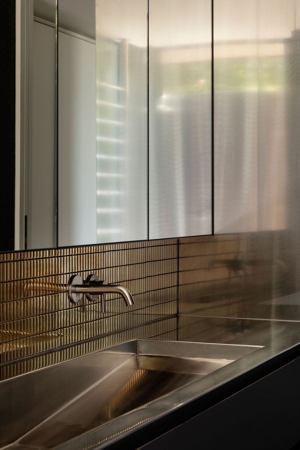 The downstairs guest bathroom provides a "magpie" like element.