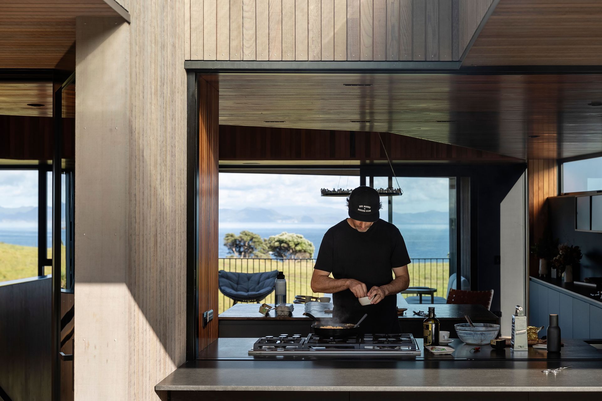The kitchen bench seamlessly integrates with the outdoor dining space.