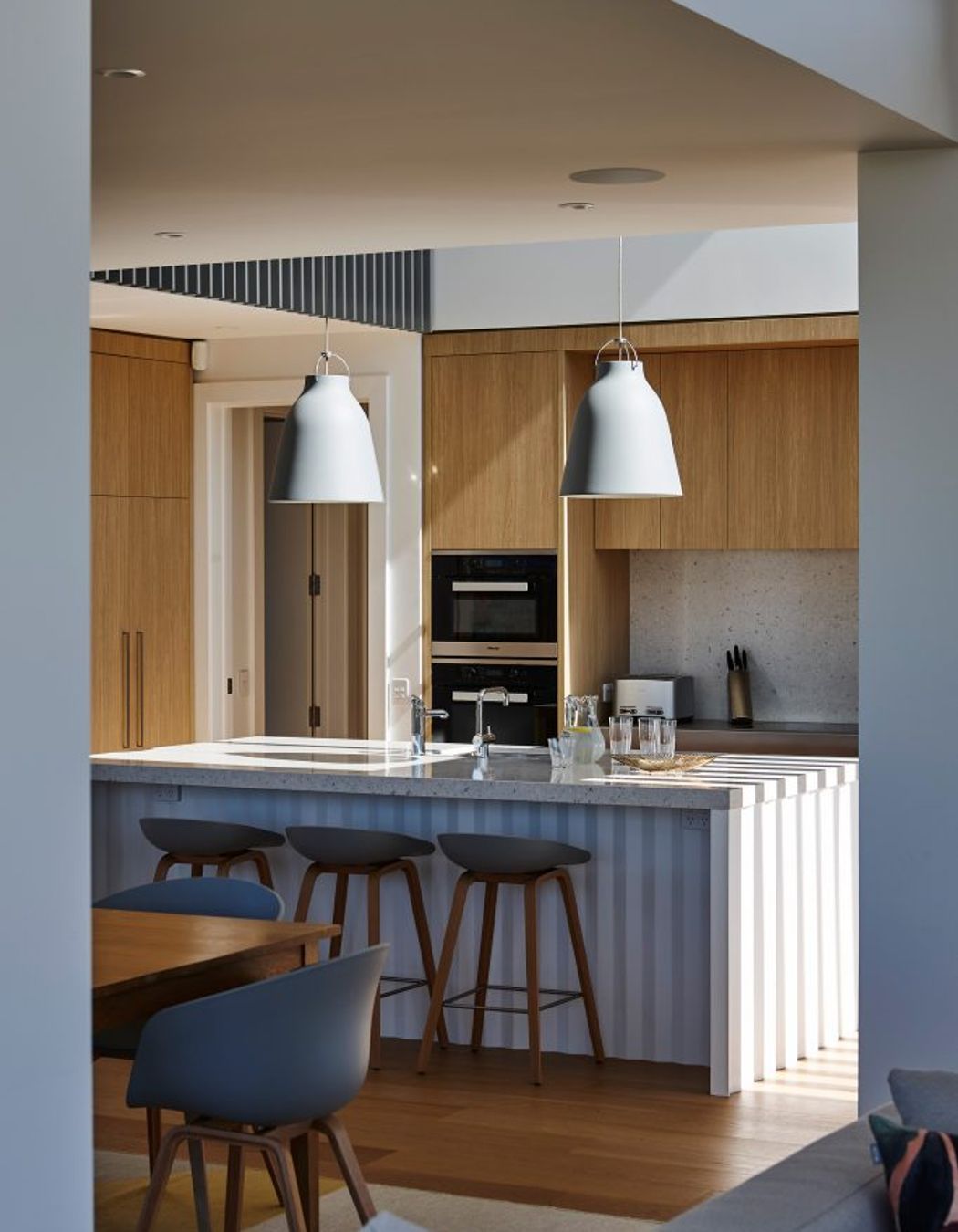 “There's quite a beautiful detail under the island bench where it has a folded origami base. We were really pleased with how they turned out. It has a little bit of crispness and a little bit of elegance to it but without being too full on,” says Kate.