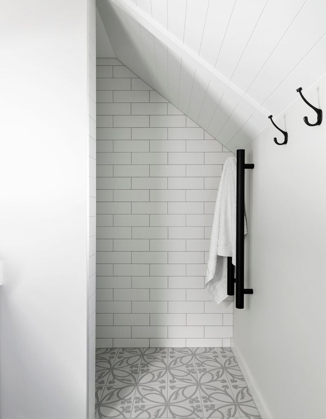 The palette of subtle tones and textural elements continues in this ensuite bathroom.
