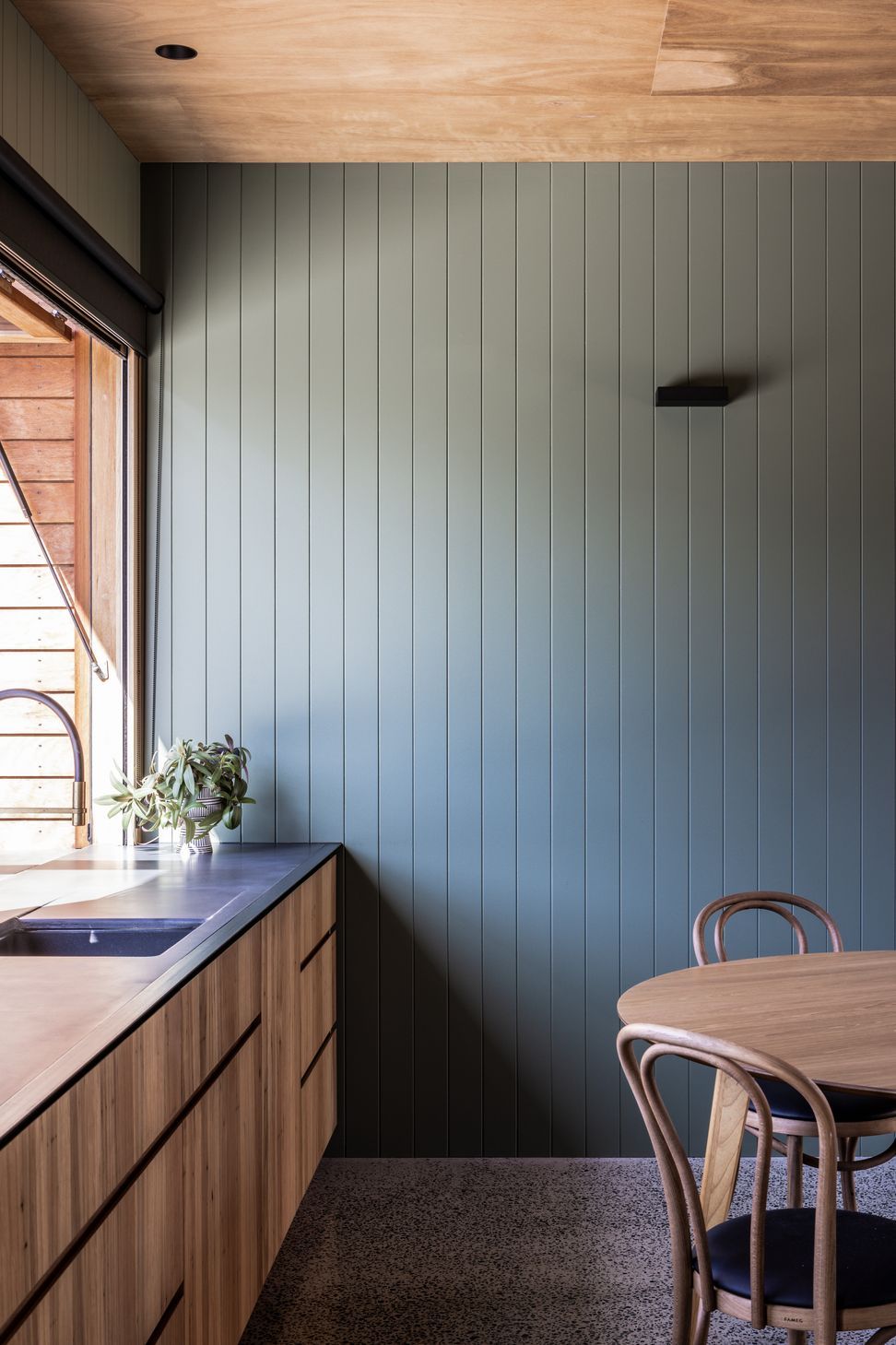 Relaxed coastal kitchen featuring Blackbutt claddings paired with VJ lining boards in Dulux 'Shire'