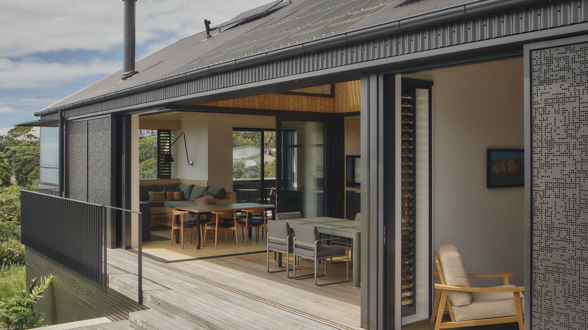 Watch Open + Shut transform as its operable perforated screens slide open and closed, allowing the home to respond to changing light, privacy and the coastal climate. Designed by Rogan Nash Architects, the adaptable façade creates a dynamic home. video