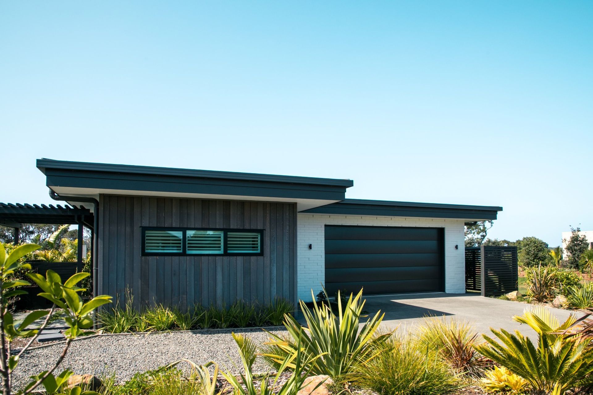 garage-door-cedar-shiplap-painted-brick-white-cladding-arcline-architecture.jpg