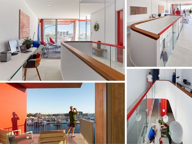 Collage of a bright contemporary multi-level apartment interior and balcony. The main views show a glass balustrade around an open stair or landing, with a timber handrail and bold red trim. A compact home office with desk, monitor, chair and shelving sits beside floor-to-ceiling glazing, while the balcony overlooks a marina. Additional views show a lower dining or living area beneath the landing, with white pendant lights and modern furnishings.