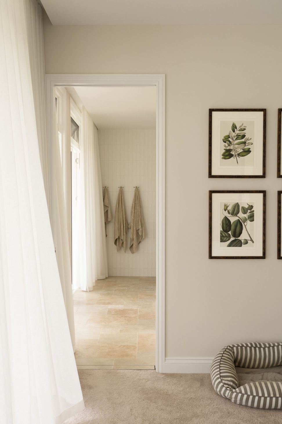 Euroa Farm - Hall. Linen towels hung beside framed botanical prints.