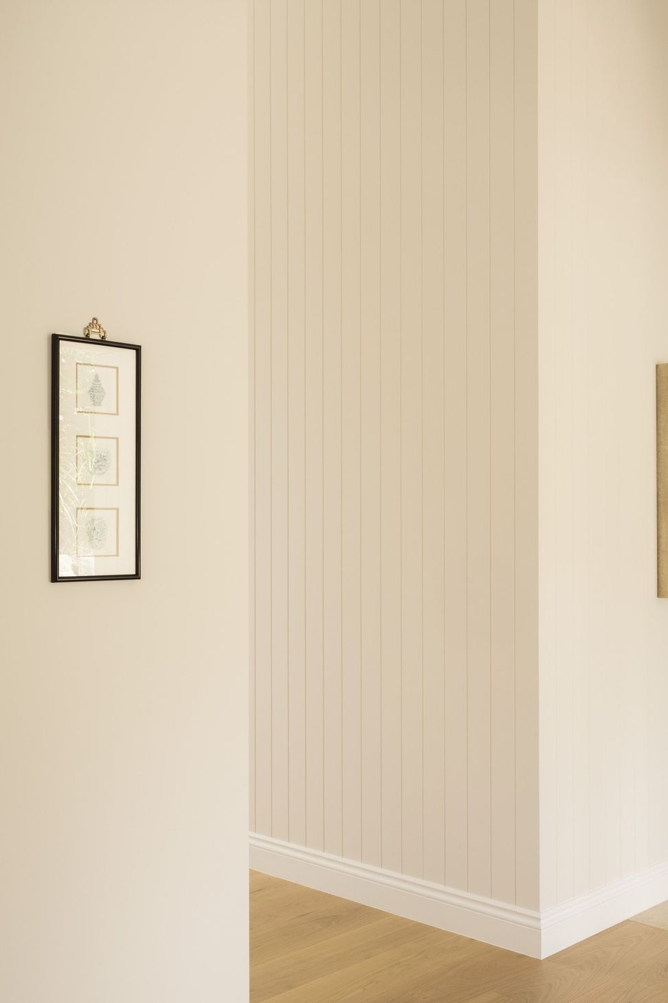 Euroa Farm - Hall. Botanical print against vertical boarded walls.