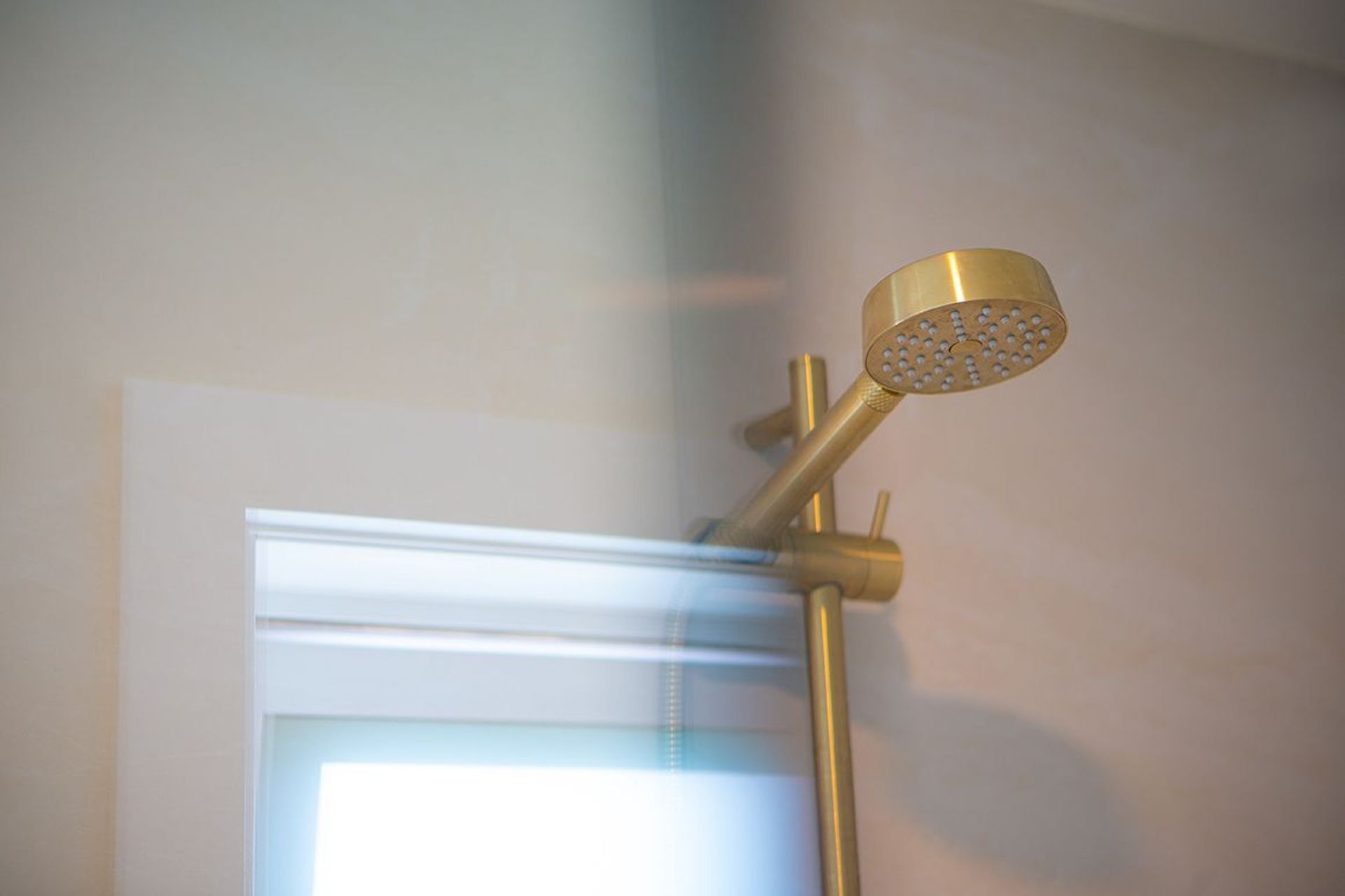 Light filled shower next to the windows.