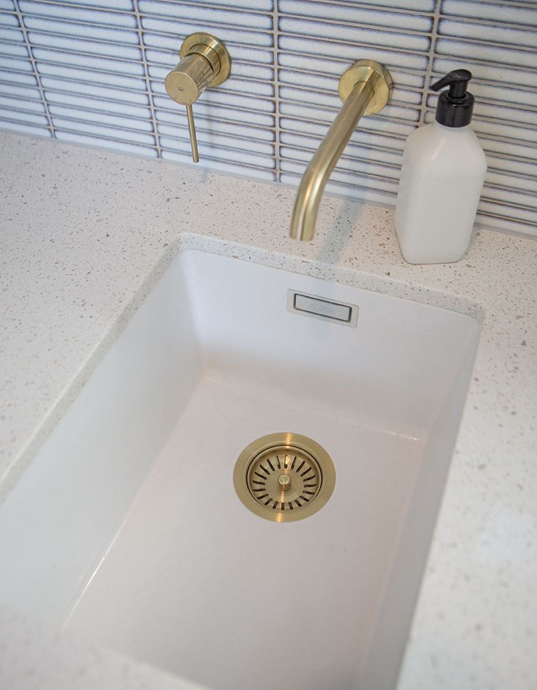 Brass fittings, including the waste. The Blanco Silgranite sink can also take a small bucket, or can be used for soaking.