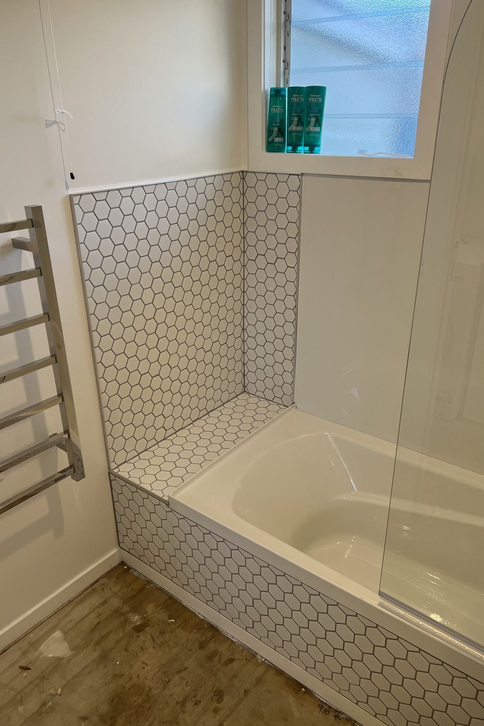 Tiled bath cradle.