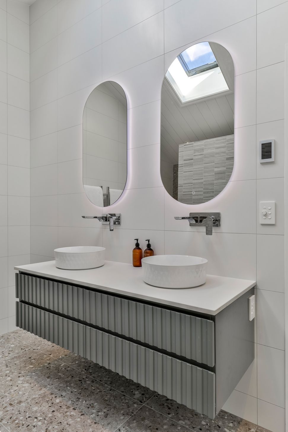 TILES & BATHWARE SUPPLIED BY TILE DEPOT . Vanity: Customised AIntree Wall Hung 1500mm / Basins: Radial 355 textured white / Mirrors: Ambience Back Lit Mirror Pill 500x1000H