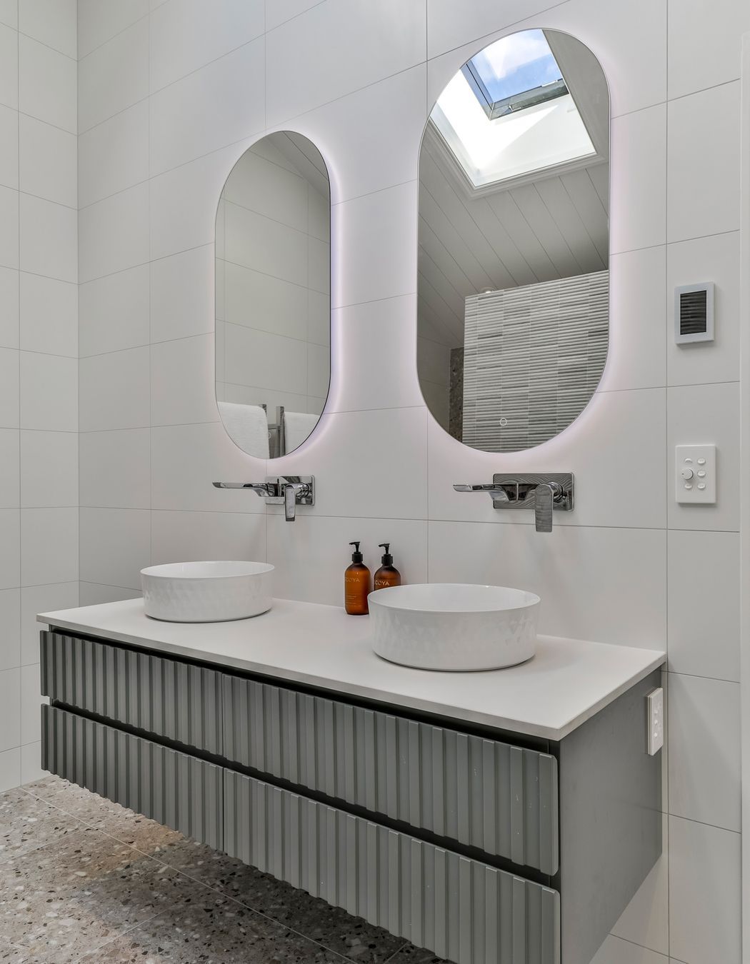 TILES & BATHWARE SUPPLIED BY TILE DEPOT . Vanity: Customised AIntree Wall Hung 1500mm / Basins: Radial 355 textured white / Mirrors: Ambience Back Lit Mirror Pill 500x1000H