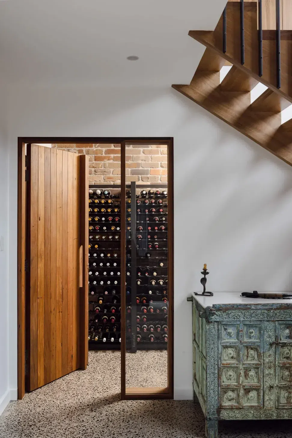 clifftops-wombarra-interior-design-bespoke-wine-cellar.webp