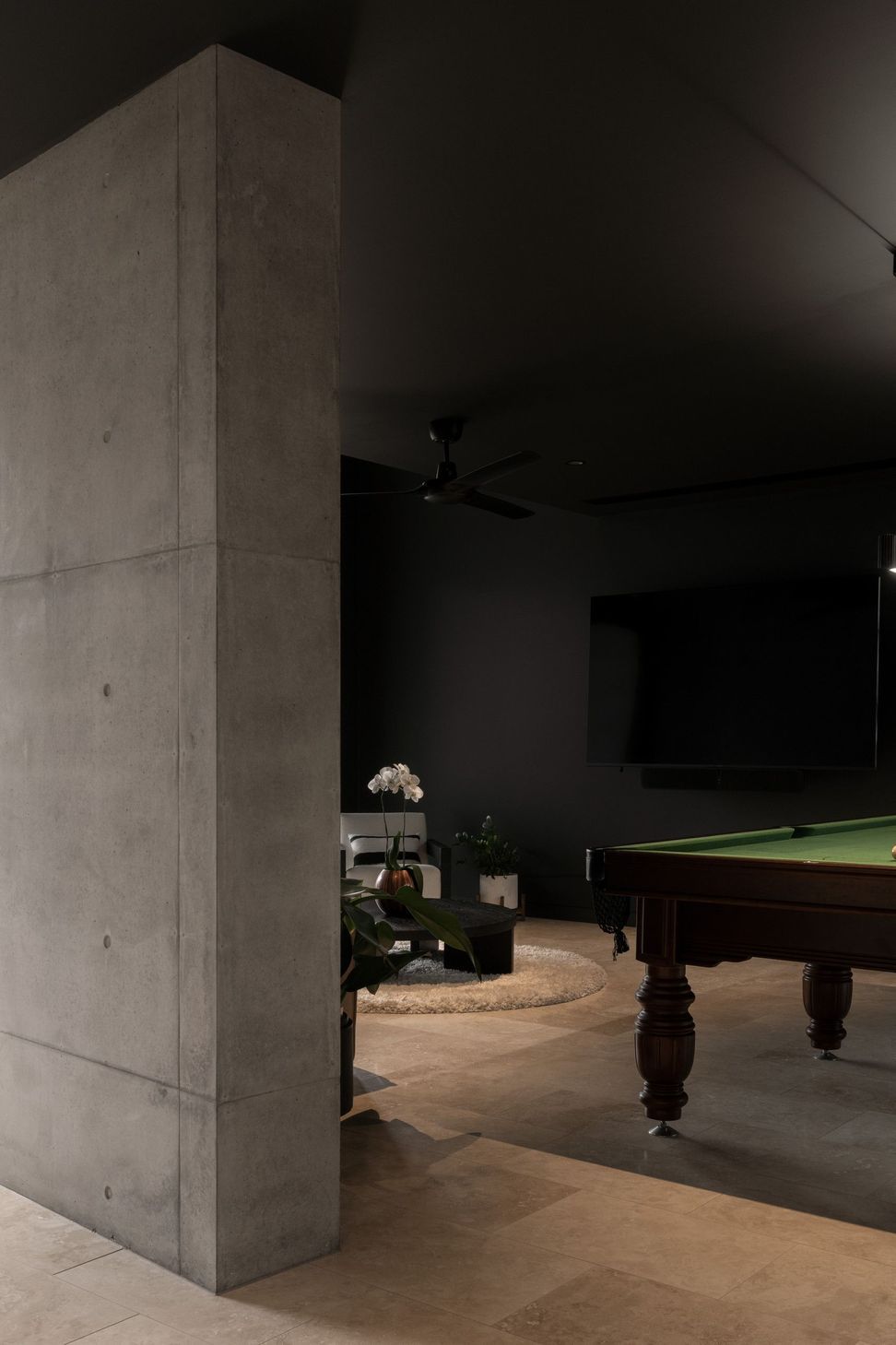 Carwoola House - Games Room. Off-form concrete walls and a billiard table in the games room.