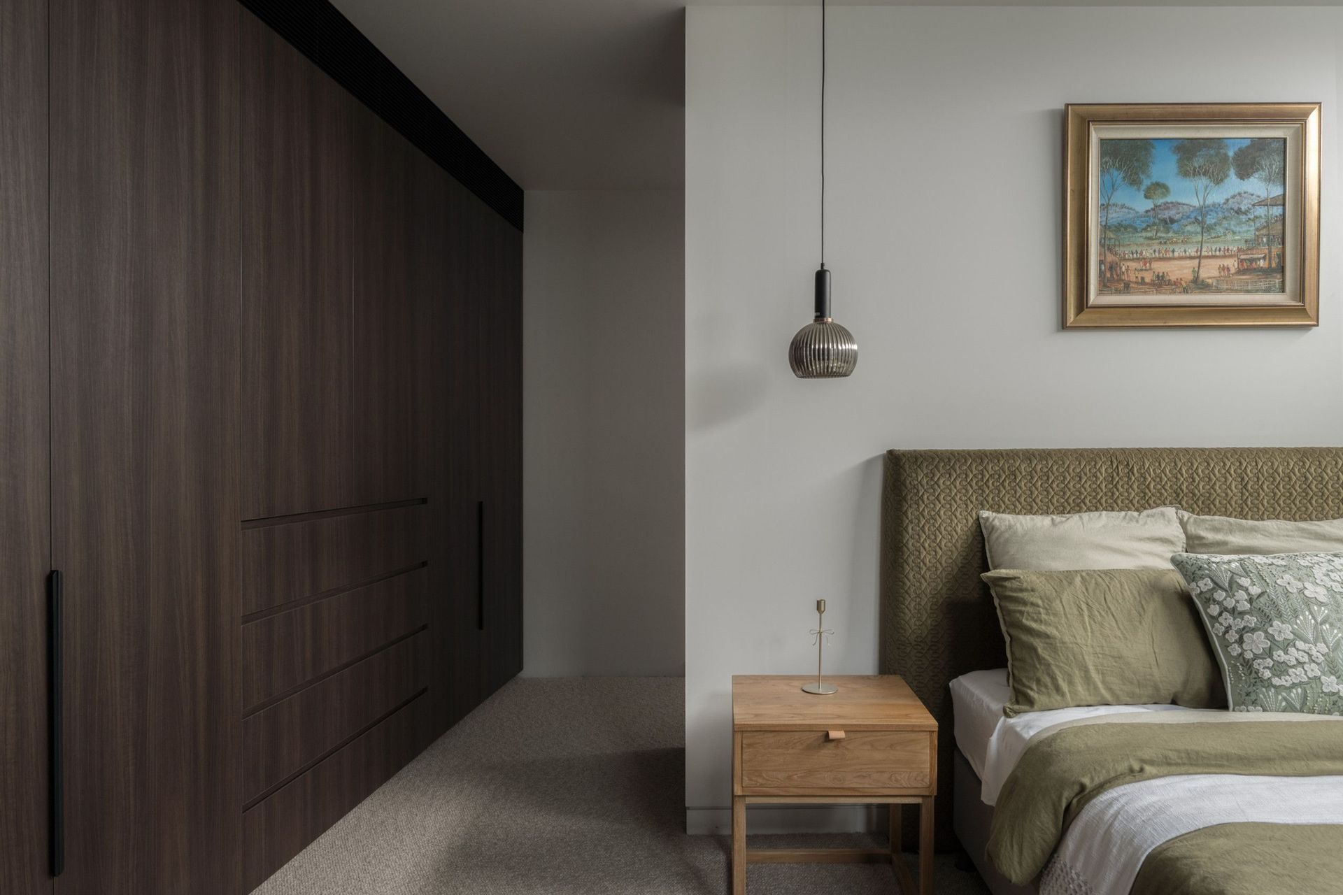 Carwoola House - Bedroom. Bedroom with dark timber wardrobes and a woven bedhead.