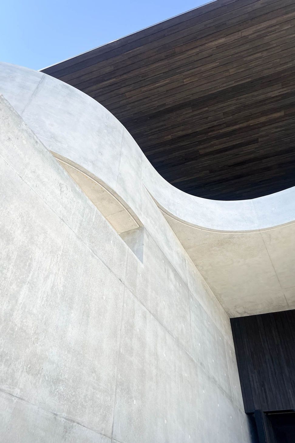 Carwoola House - Exterior. Sculpted concrete curves seen from below.