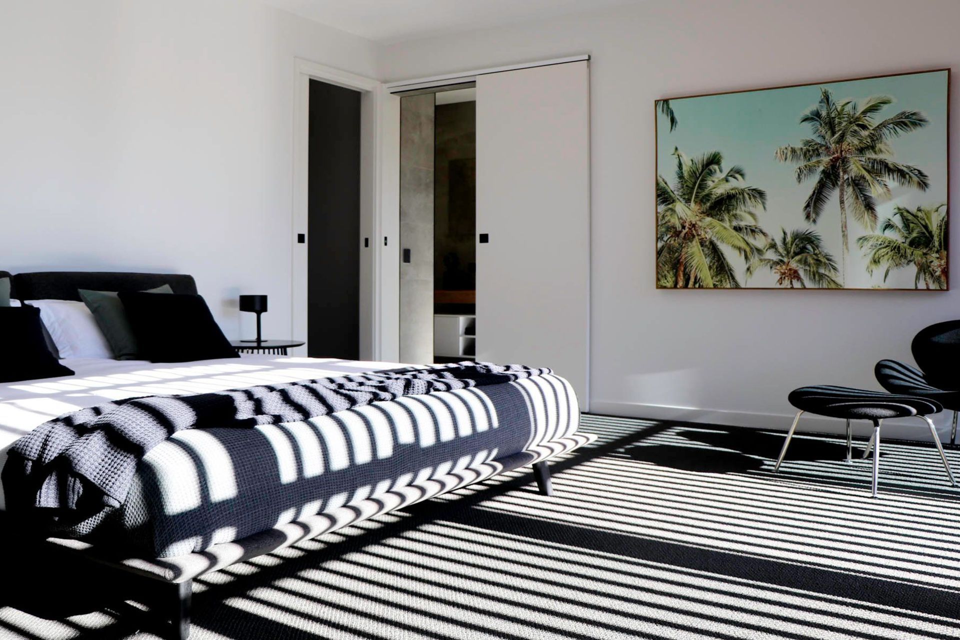 Glennon Residence - Bedroom. Bedroom with monochrome linen and a tropical artwork.