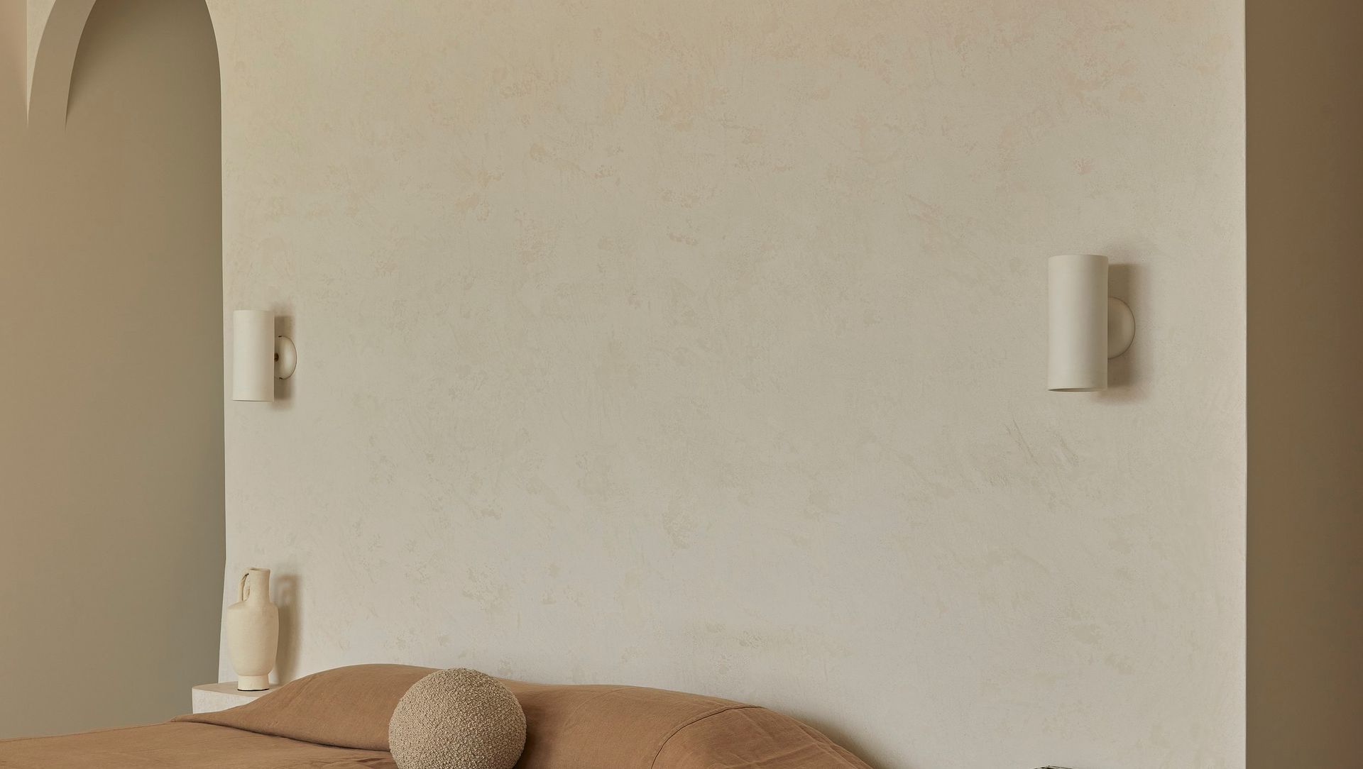 Studio Enti’s Eos Wall Lights beautifully blending with the natural palette of the home.