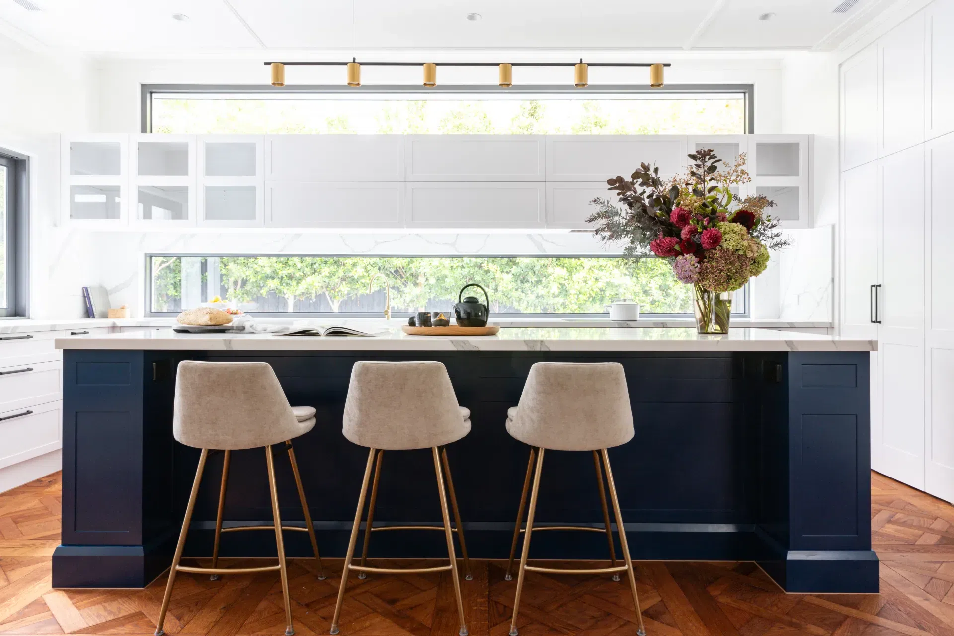 Malvern-kitchen-with-blue-island-and-beige-velvet-barstools.webp