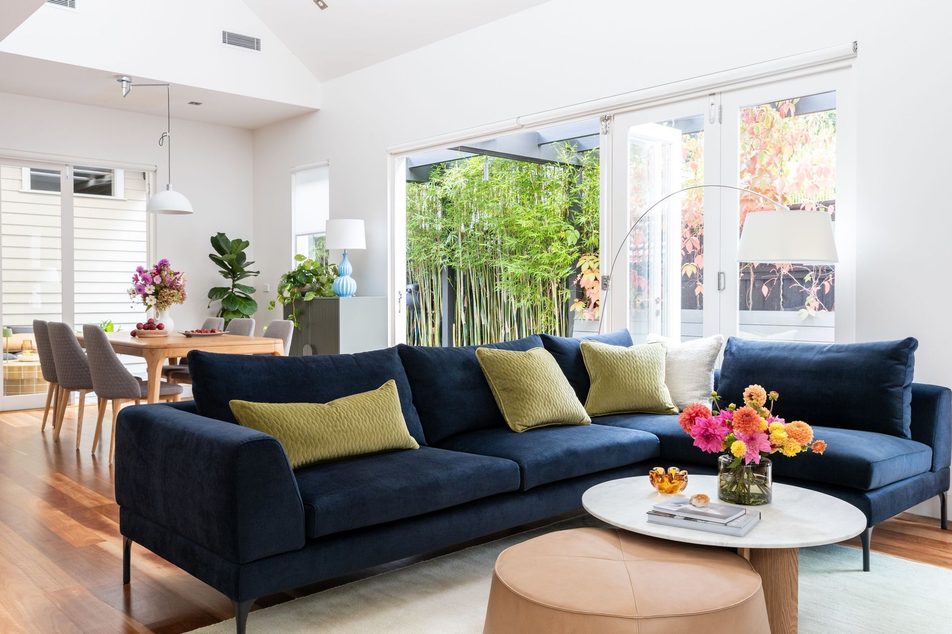 living-meals-and-outdoor-living-navy-sofa-green-cushions.jpg