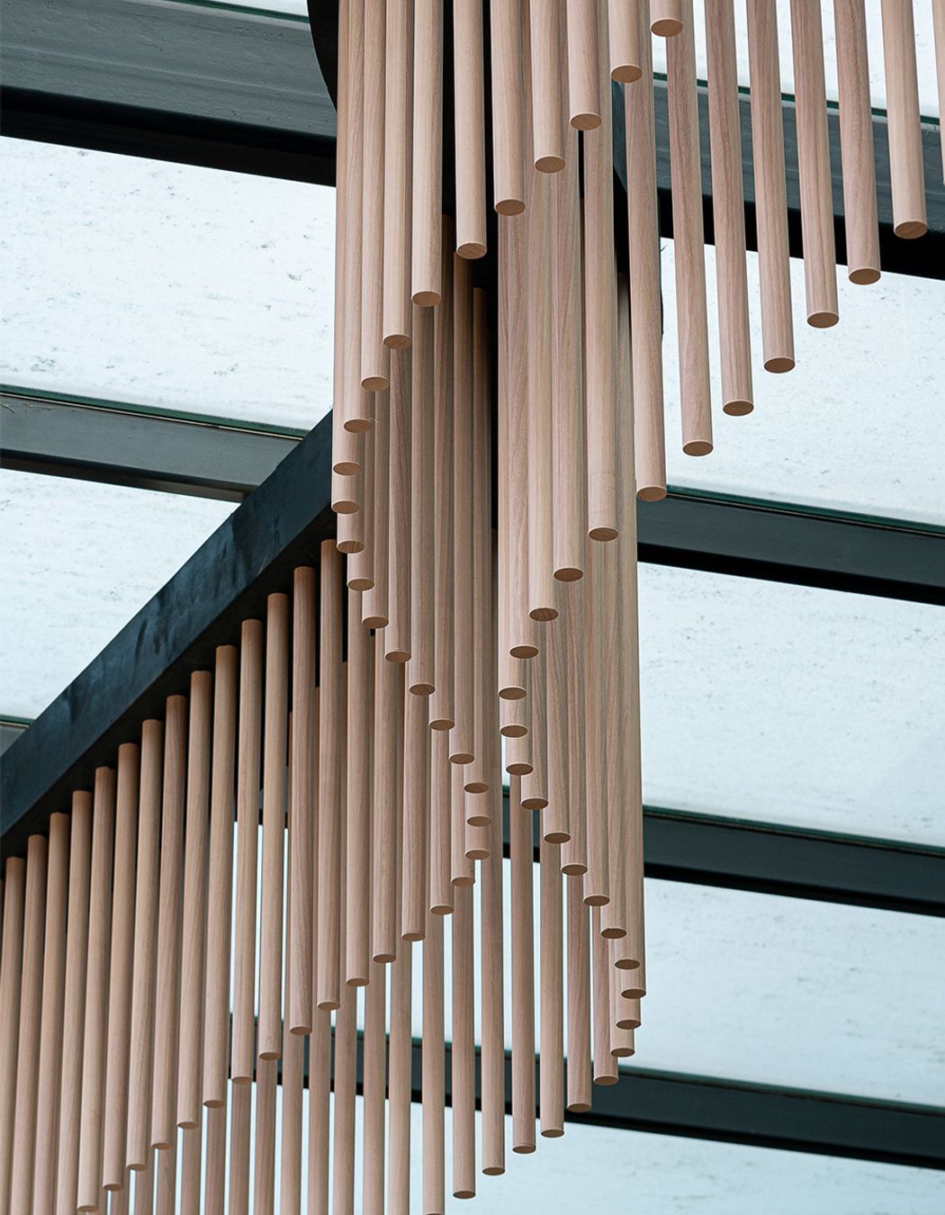 Wave-like timber battens on the building's façade