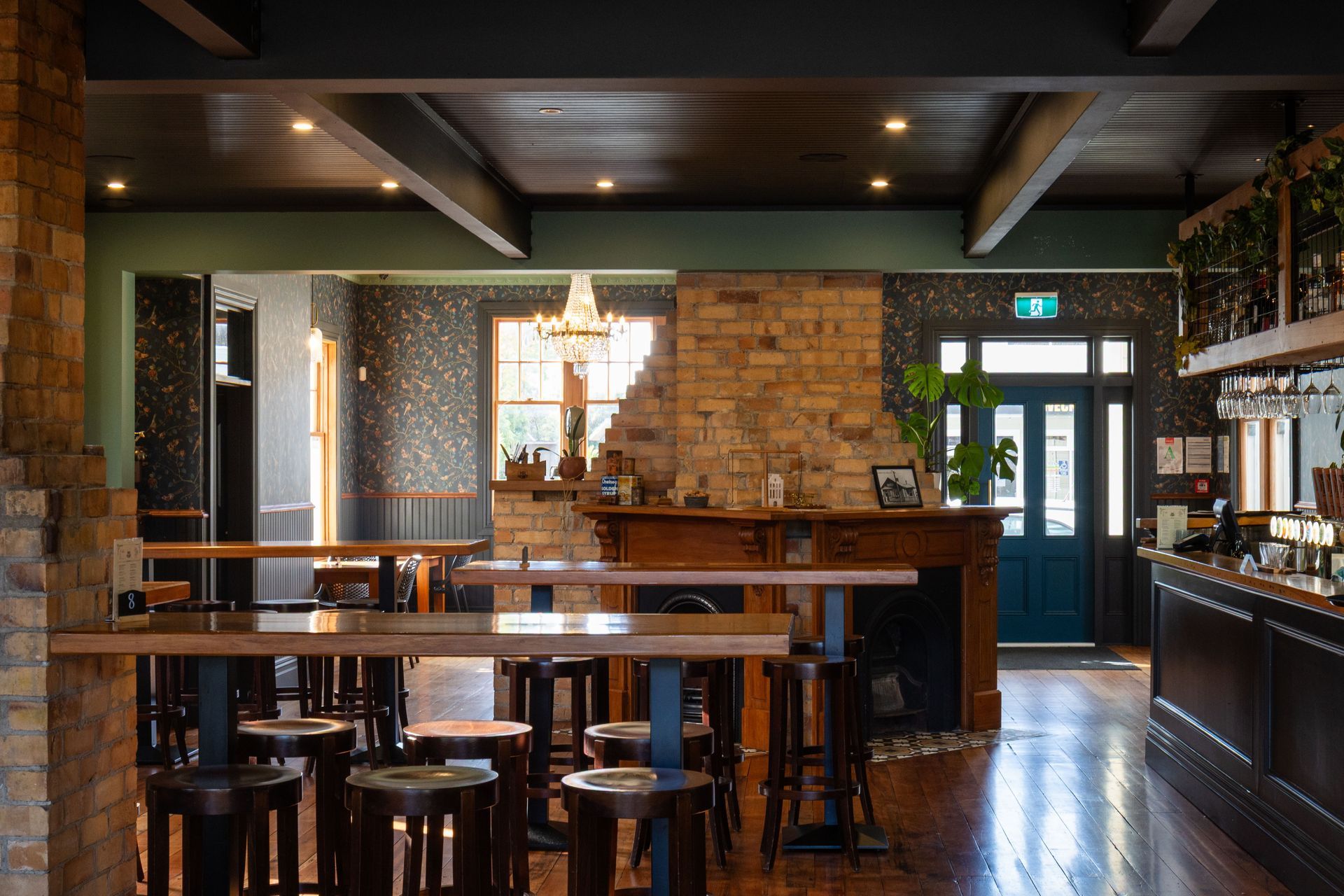 Restored area with original beams, brick chimneys and polished timber floors