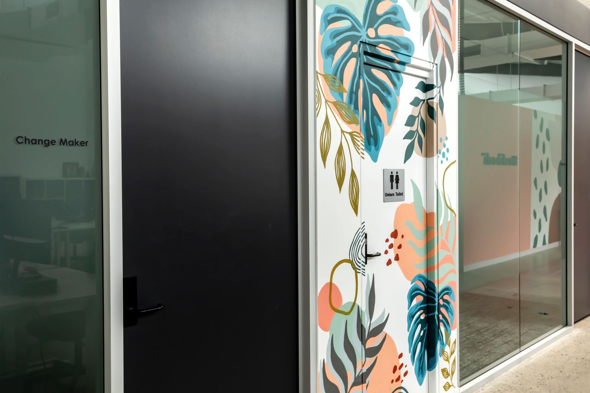 Base building bathroom dressed in colourful murals symbolising 'the entry to a retreat'.