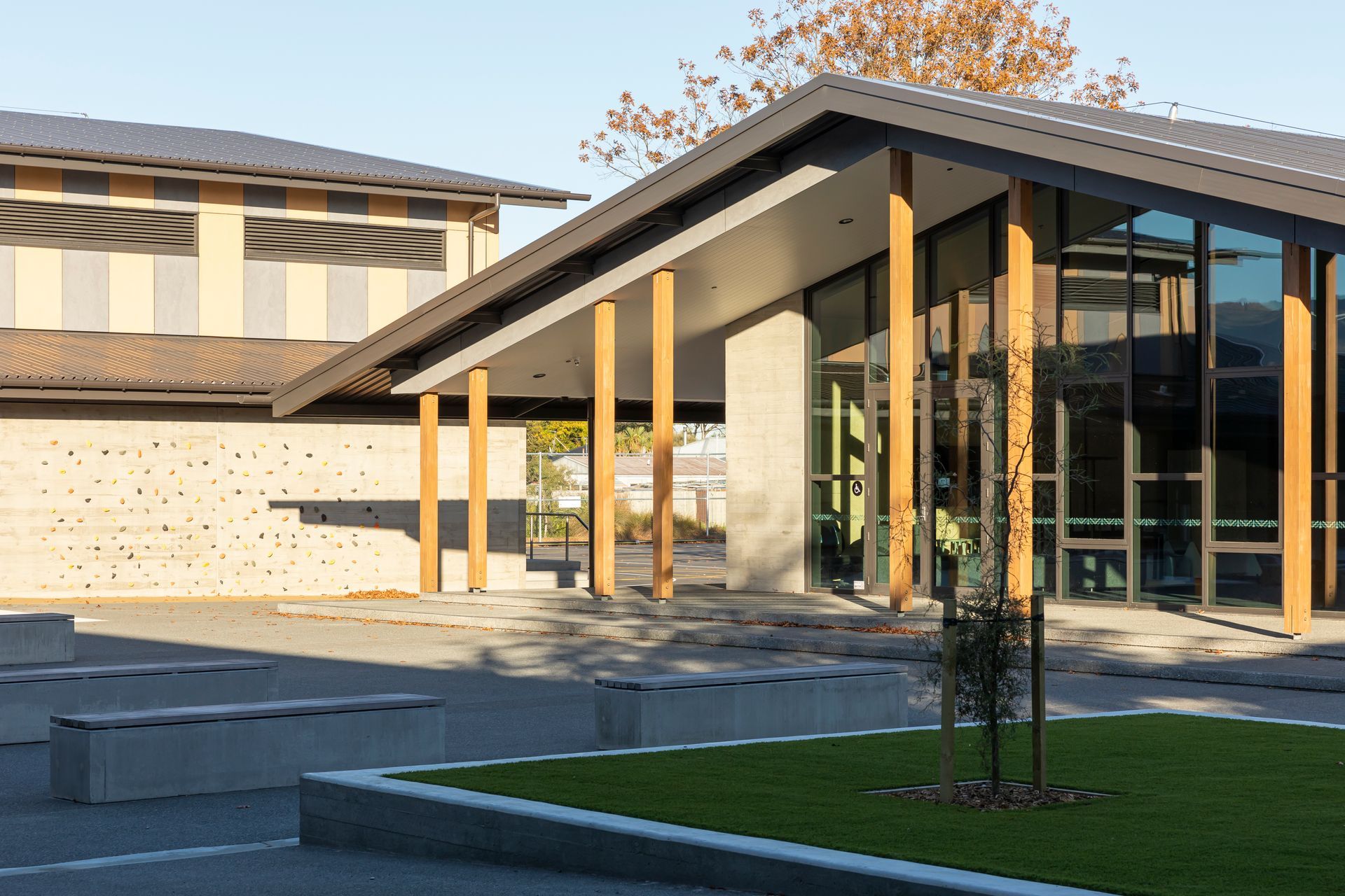 Playful elements, such as a climbing wall, add to the student experience.