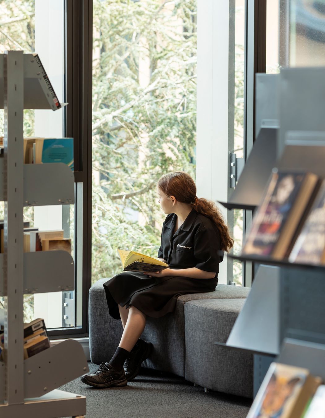 A student enjoys a quiet moment in the library.