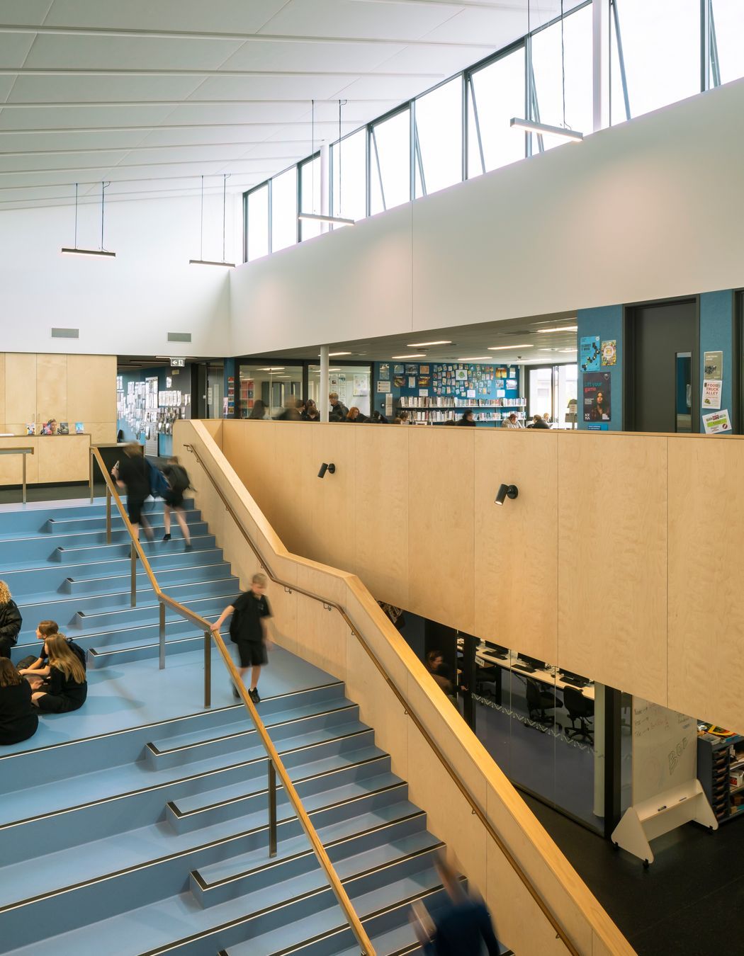 The creativity and innovation hub features blue walls and stairs.