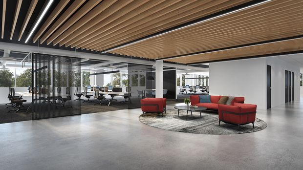 A spacious contemporary open-plan commercial office interior with polished concrete flooring, exposed services, extensive glazing, black-framed partitions, and a dramatic slatted timber ceiling. Red lounge seating and low tables form an informal breakout area beside shared workstations and meeting spaces.
