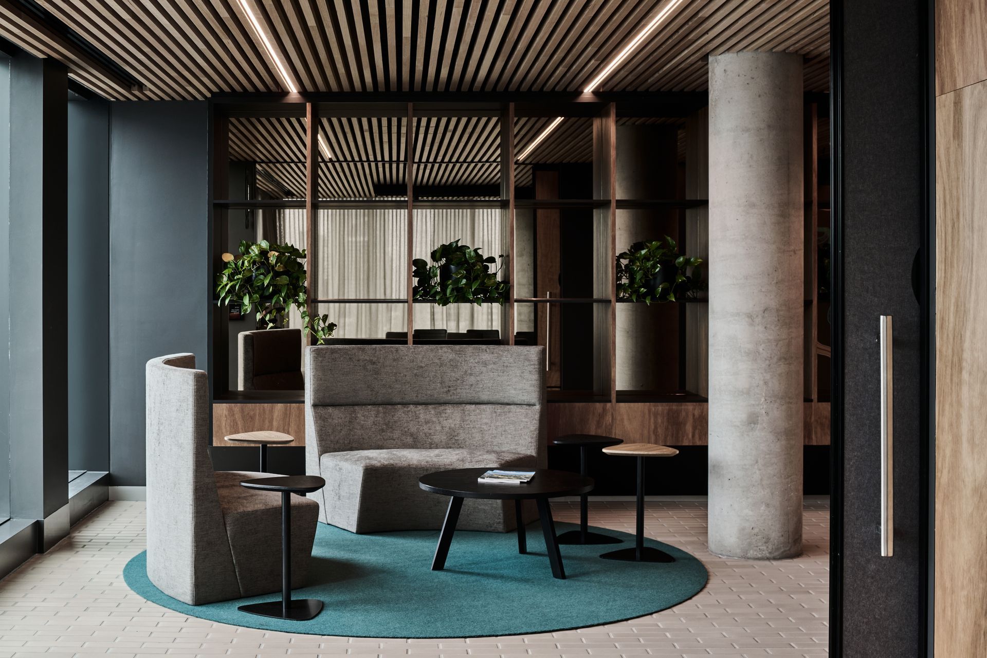 The natural tone of the Aluminium brick tiles pair well with the Blackbutt timber and the Australiana/eucalypt palette