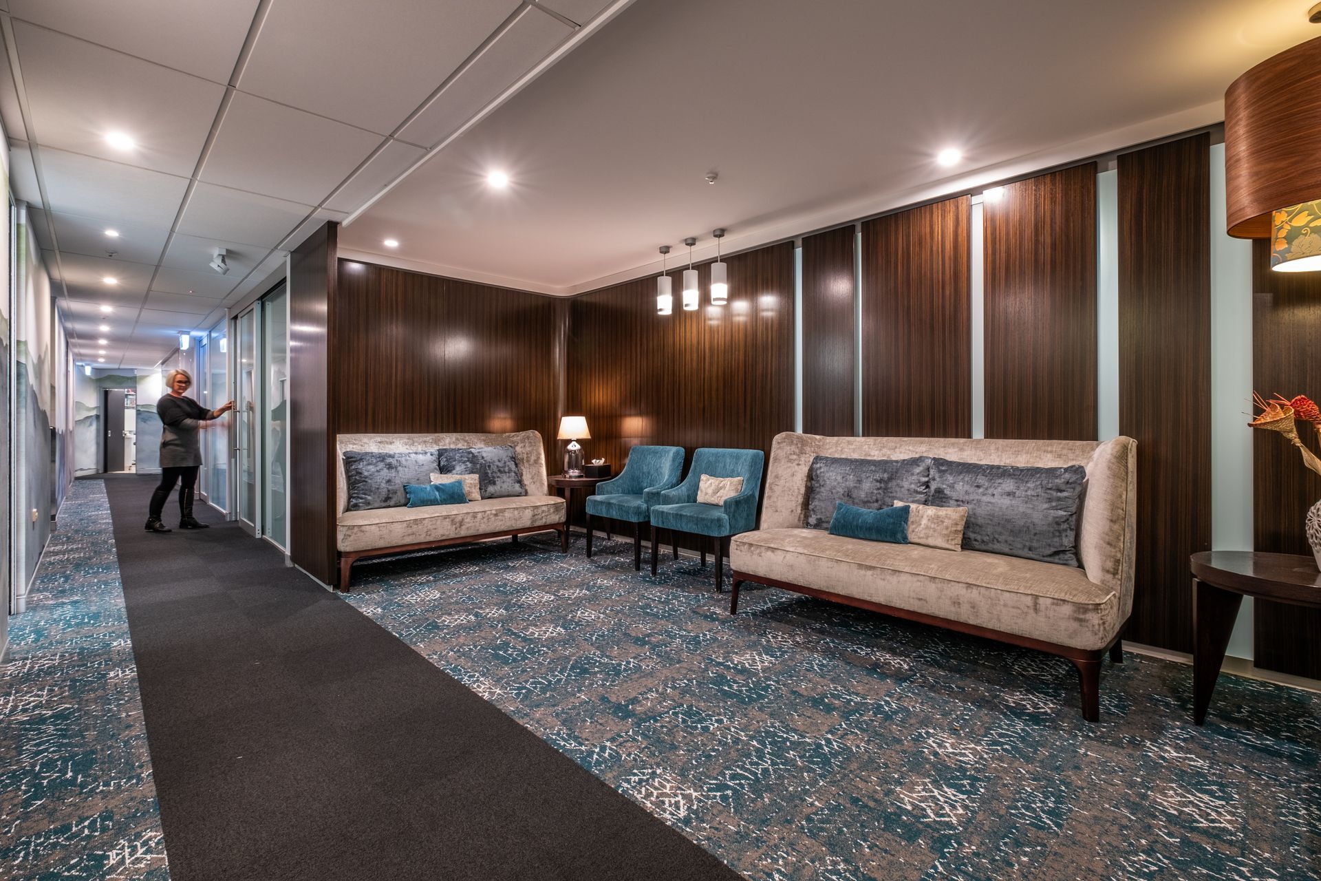 Feature carpet tile strip leads visitors down the hallway