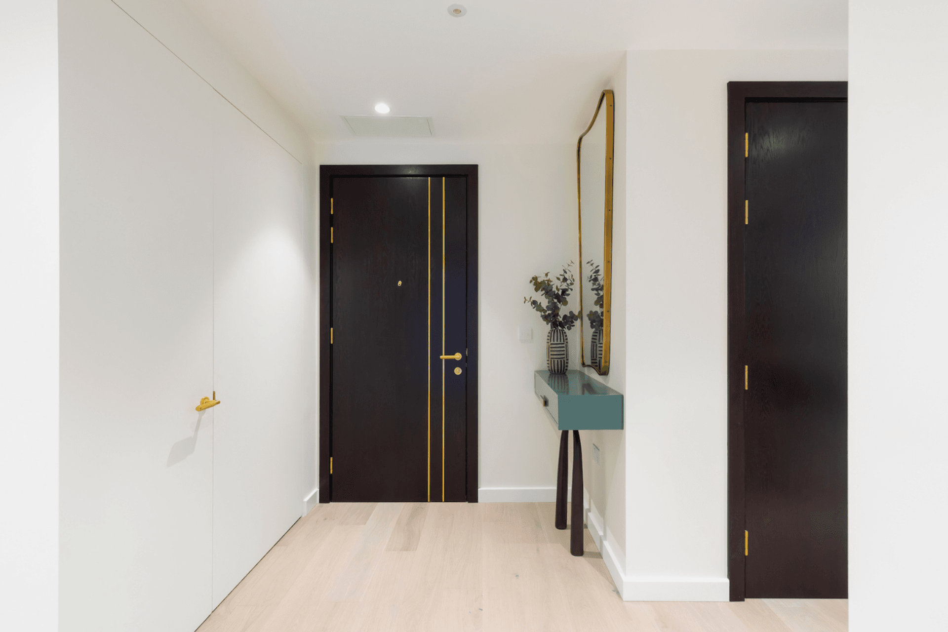 The white wall on the left keeps the entry space uncluttered with an EzyJamb SRC framed double-door.