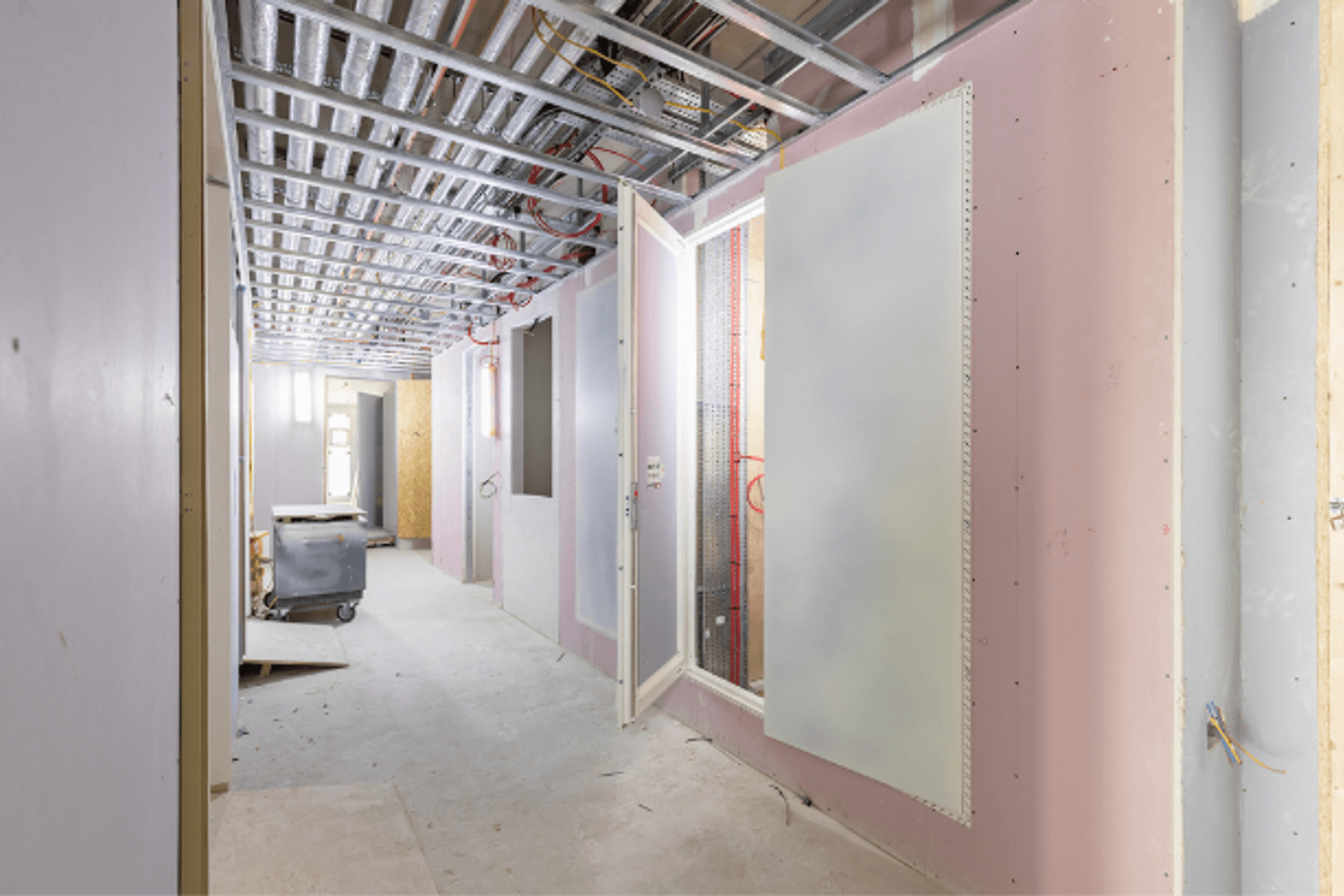 A Standard AccessDor riser door panel installed during construction.