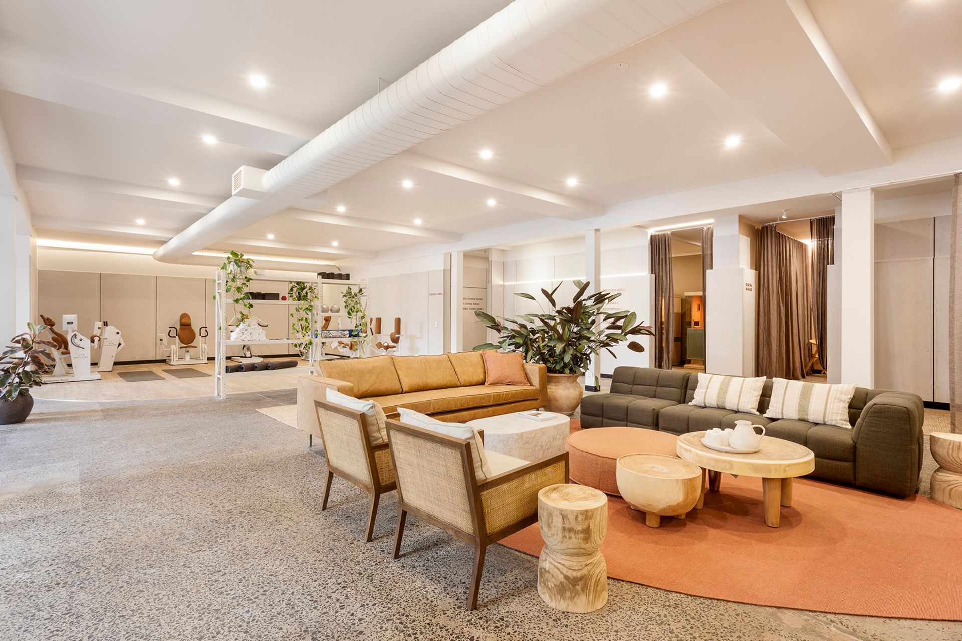 Pictured here: Adeline Square Occasional Chair, Vittoria Olive Modular Sofa, Woodland Organic Coffee Table, Orlando Seamed Round Ottoman and Elle Block Oval Coffee Table