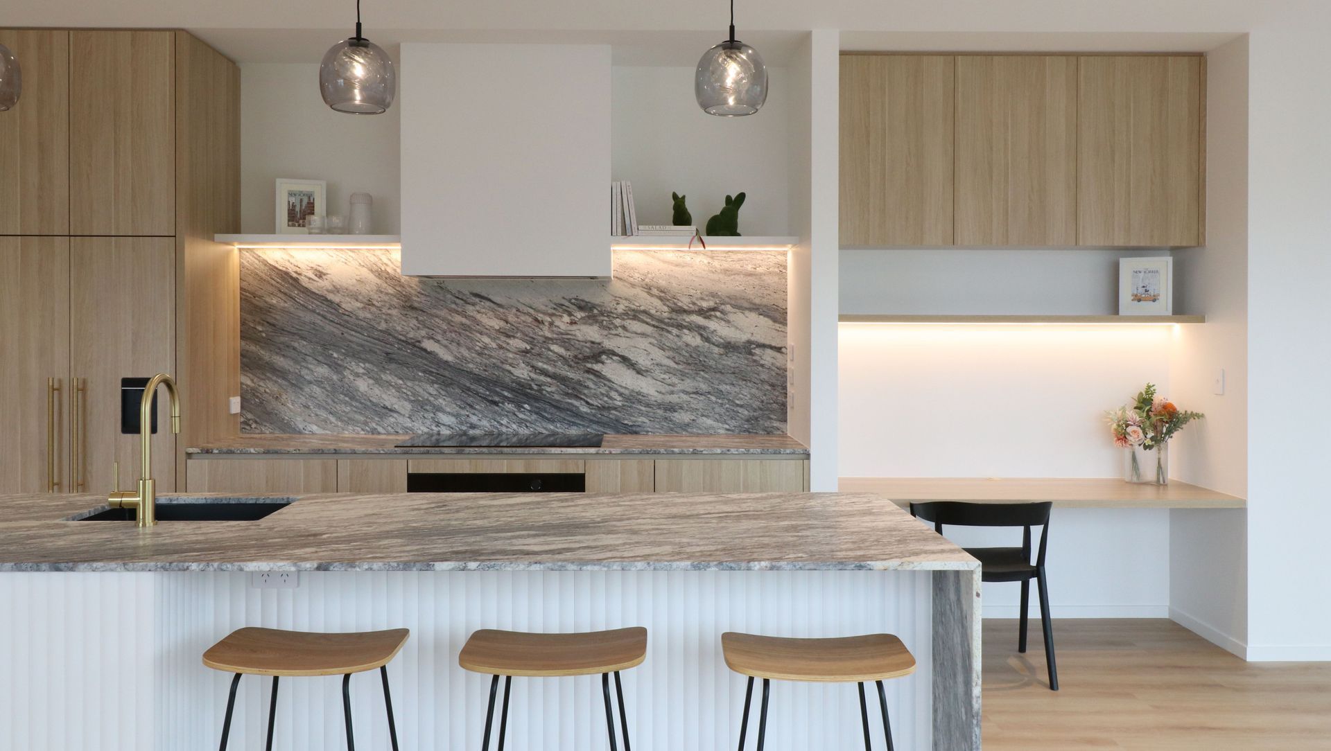 Curved Timber Island with Leathered Granite Elegance banner