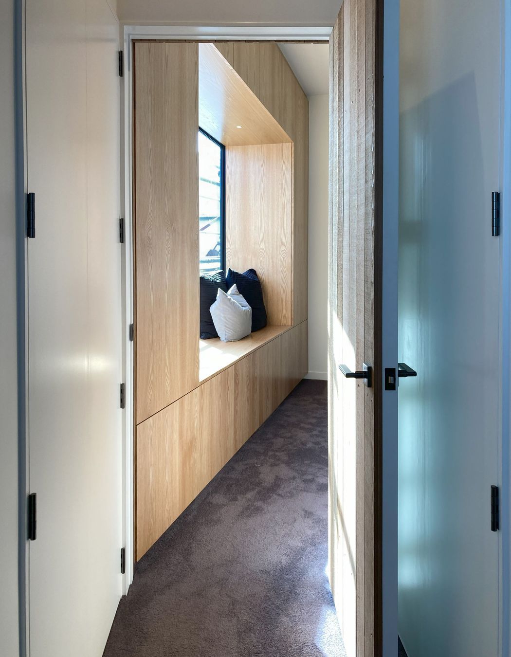 White V groove, black island and a scullery with a touch of pink