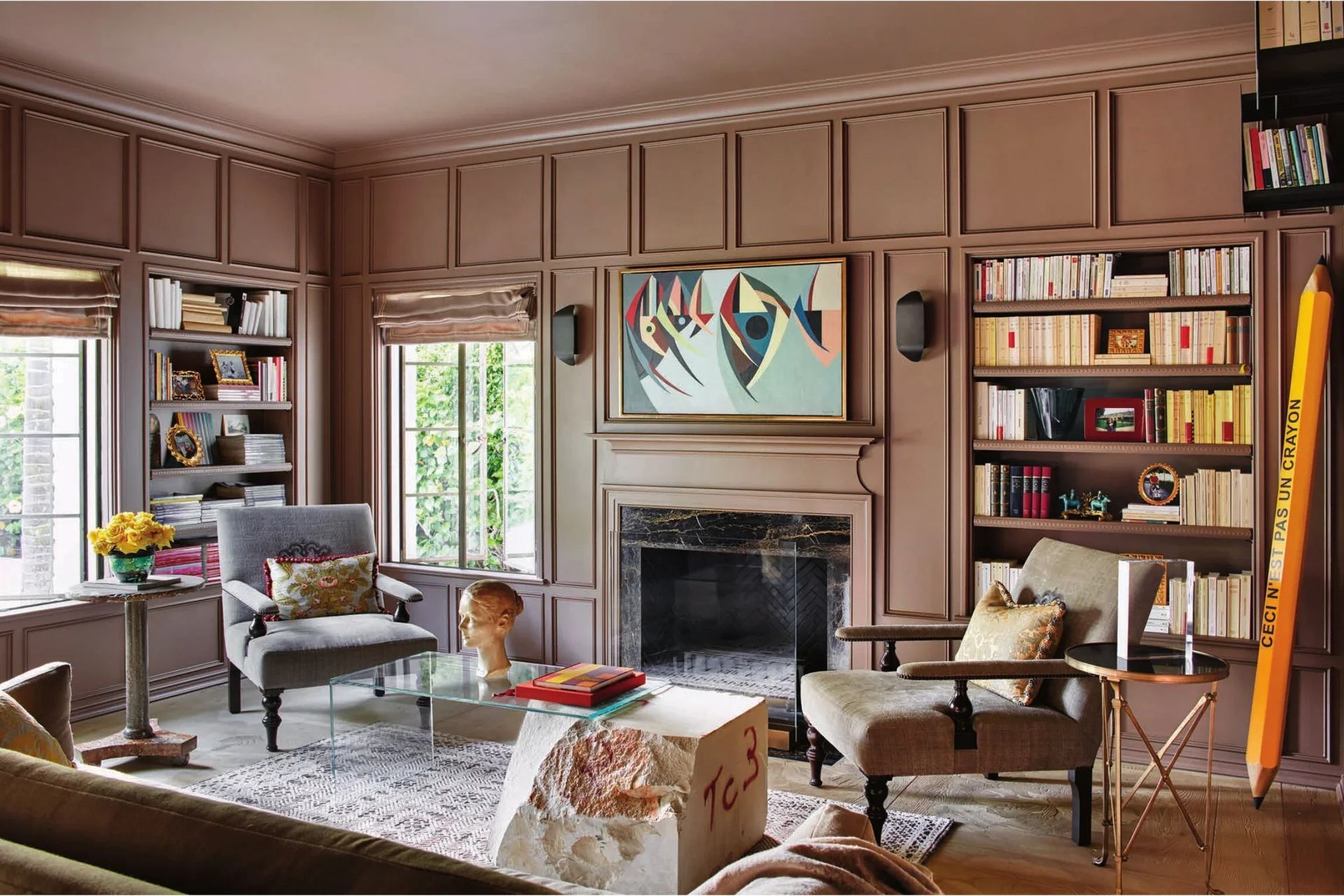 luxury-home-library-brown-paneled-walls-marble-fireplace-modern-artwebp-ap-compressed.jpg
