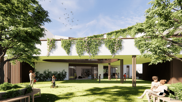 Architectural rendering of a contemporary low-rise building arranged around a landscaped communal lawn or courtyard. The facade combines white rendered walls, a bright lime-green horizontal band, dark vertical timber-like screening, extensive climbing greenery, and a broad covered outdoor walkway. Mature trees, lawn, people, and informal seating create a family-oriented garden setting.