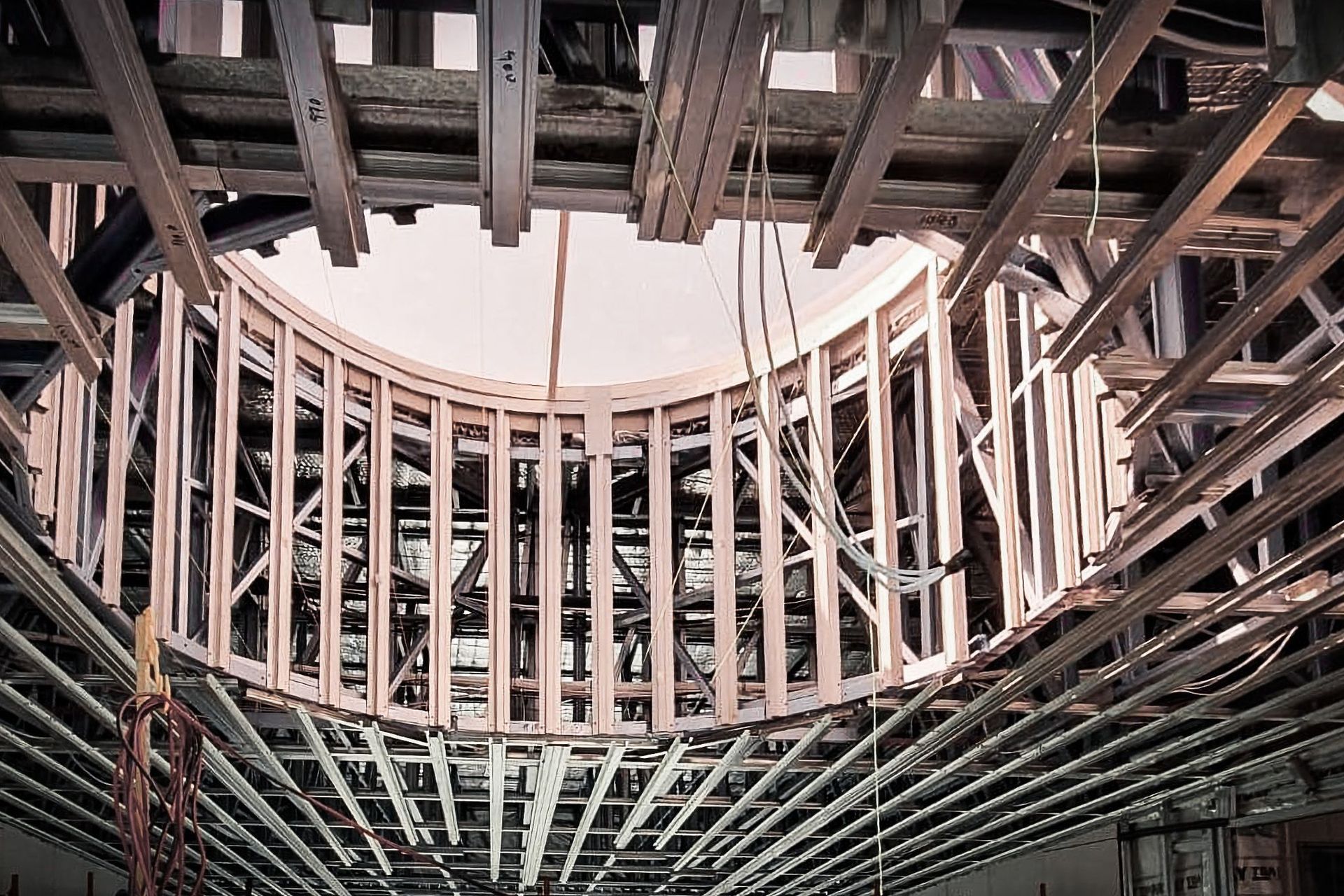 Ryde Public School  Top Hats Ceiling with Studco AU Huge skylight features allow tinted natural light to filter into the stairwells.