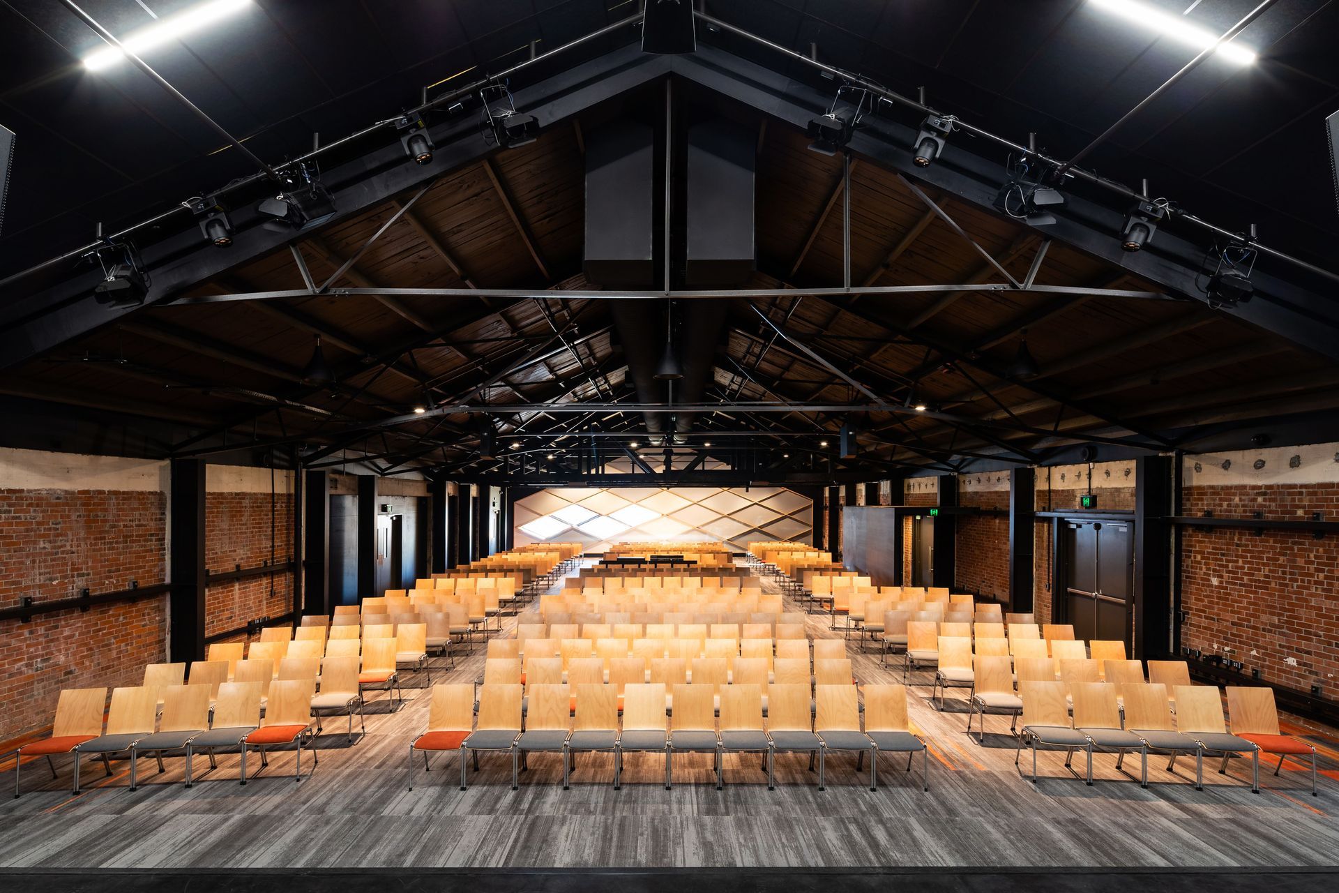 The original steel trusses and timber sarking was maintained with a new, acoustically rated roof placed on top of the existing roof structure.