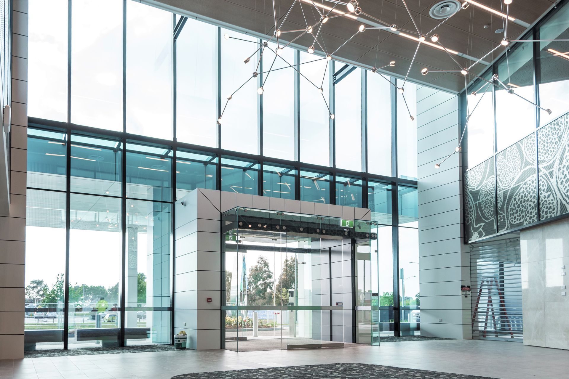 The 10m high framing of the lobby (pictured) is supported by the HEDA Tough Wall System.