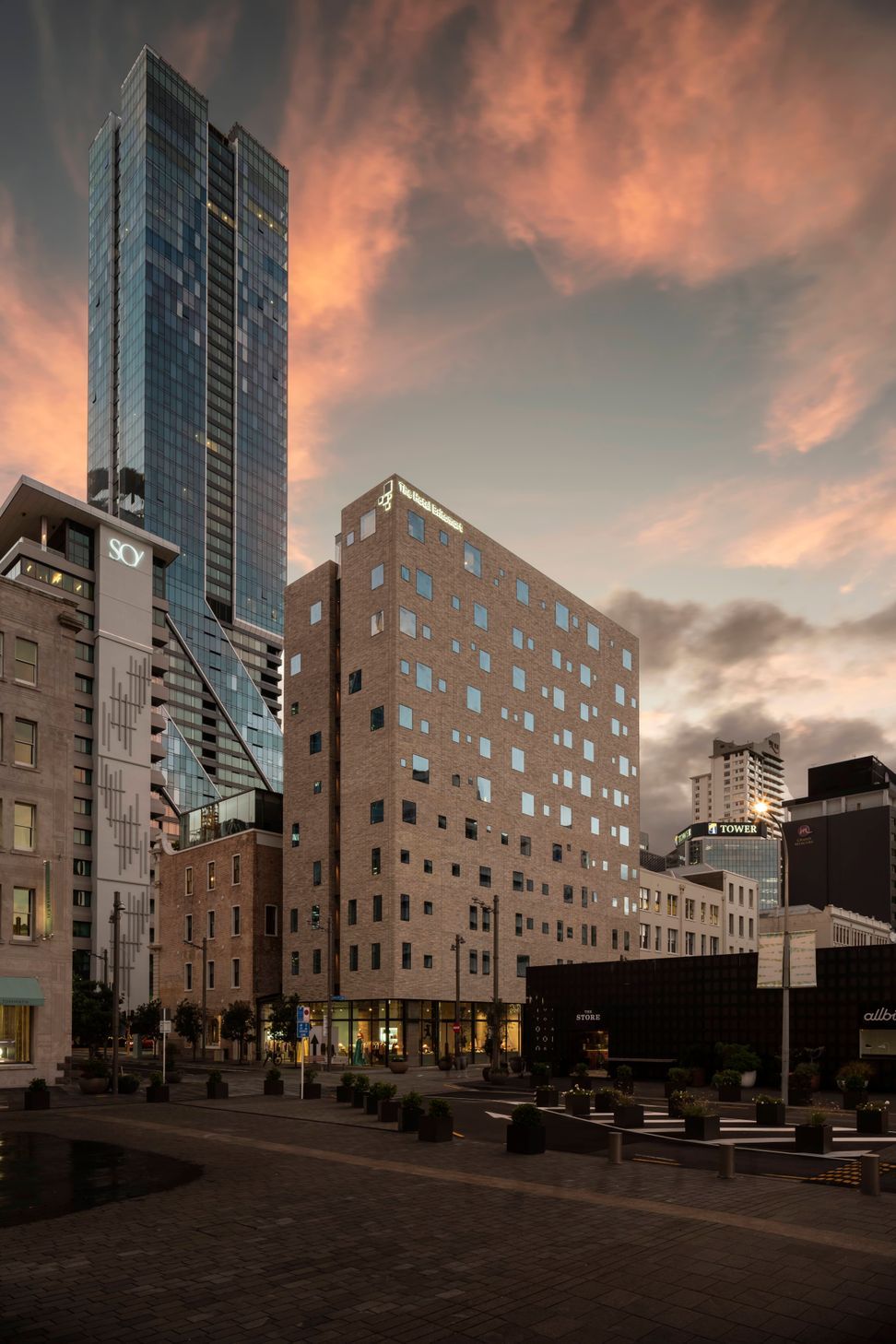 The Hotel Britomart's full brick facade is floating on a glass podium. Image: Sam Hartnett