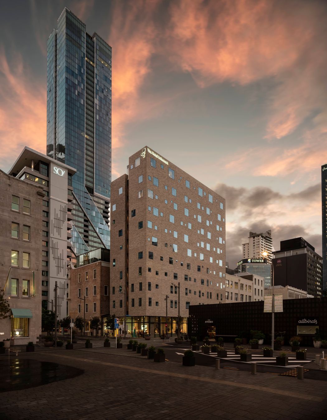 The Hotel Britomart's full brick facade is floating on a glass podium. Image: Sam Hartnett